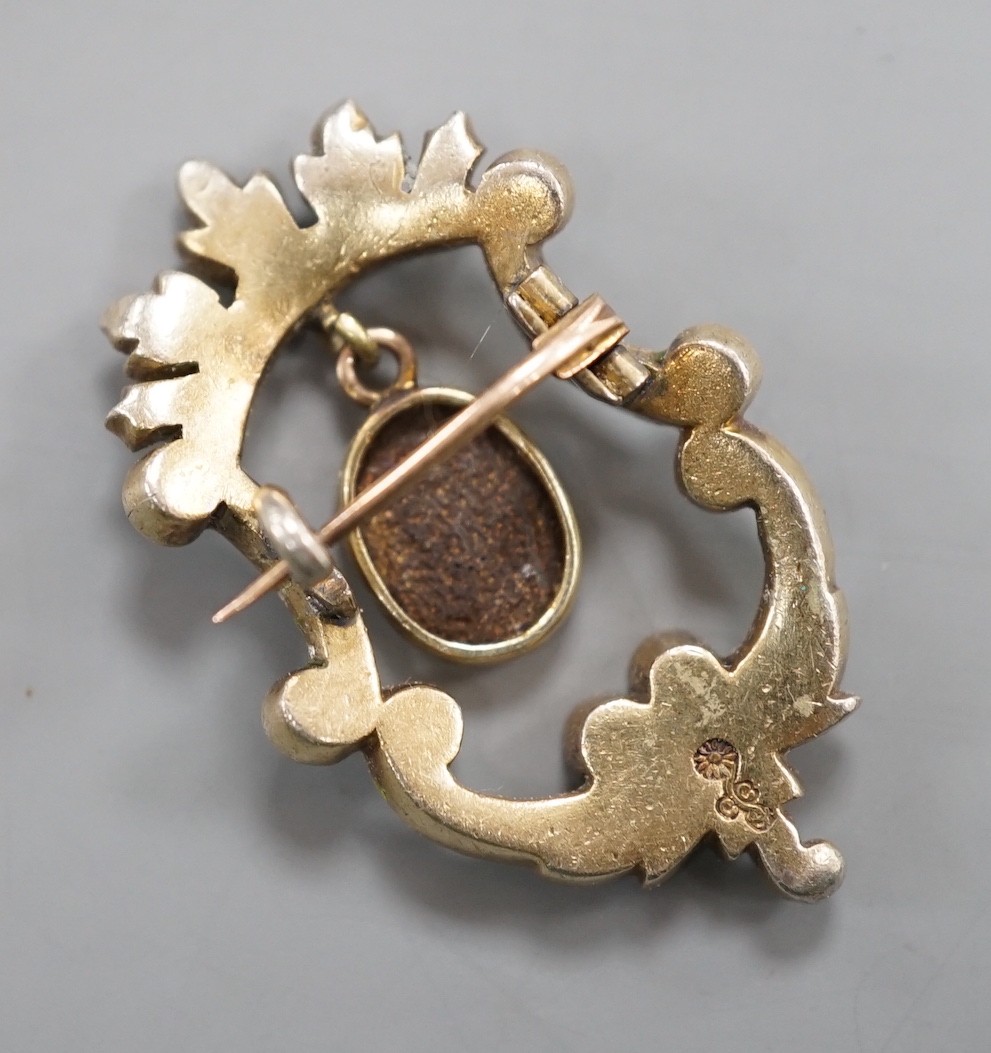 A late Victorian Child & Child yellow metal, green enamel and drop black opal set brooch, 35mm, gross weight 6.4 grams, in fitted Child & Child gilt tooled leather case.